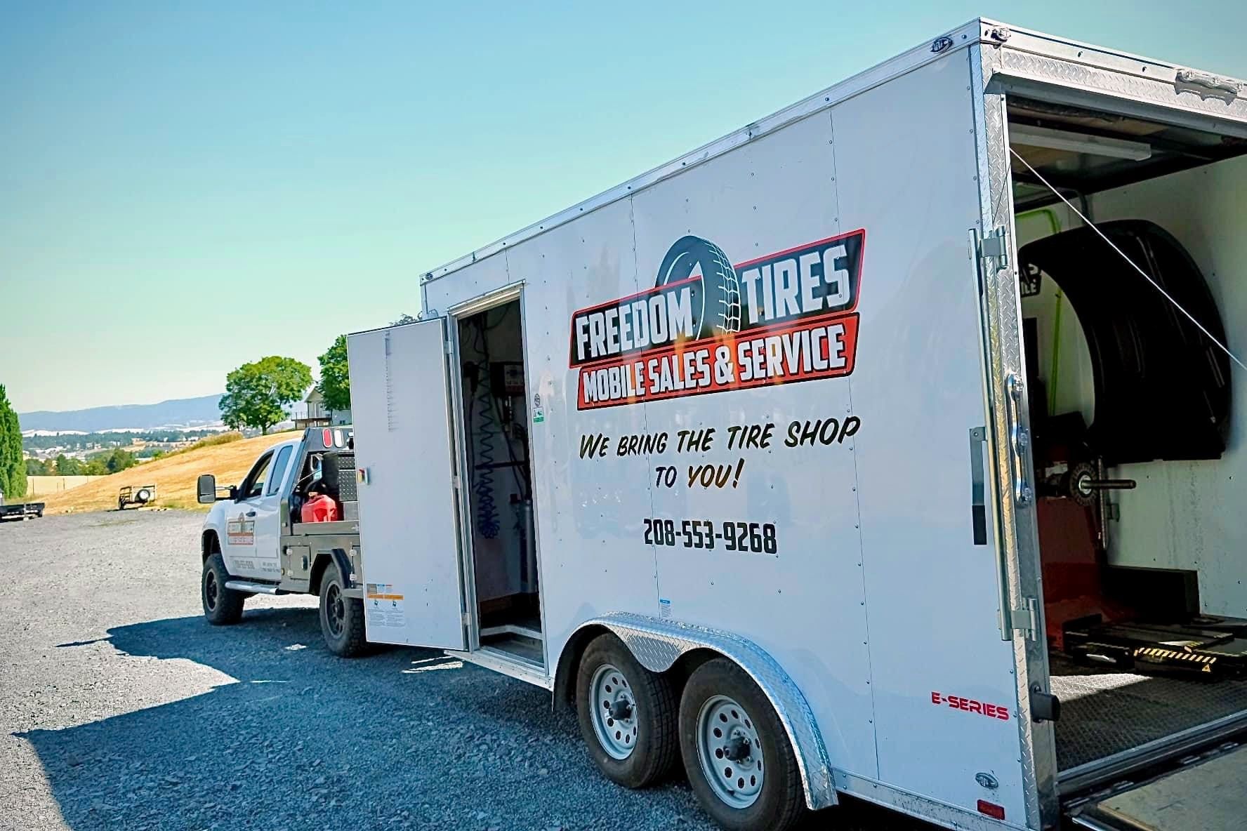 Freedom Tires mobile trailer fully equipped with doors open, ready for service